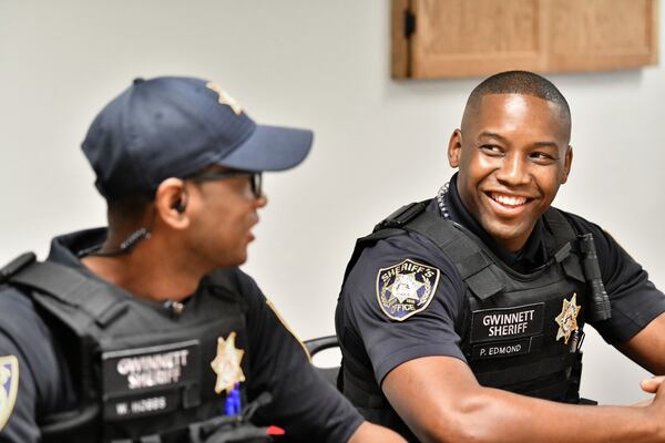 Deputy Warren Hobbs (left) and Deputy Patrick Edmond share a smile at Gwinnett County Jail on Thursday, Sept. 10, 2020. In just a matter of weeks, Edmond and Hobbs suffered life-threatening medical emergencies in the Gwinnett County Jail, and inmates came to their aid both times. (Hyosub Shin / Hyosub.Shin@ajc.com)