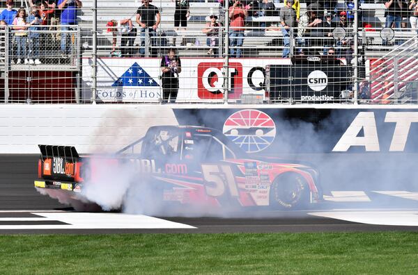 Corey Heim (#51) celebrates with a burnout after winning during the Fr8 208 NASCAR Camping World Truck Series Race at Atlanta Motor Speedway in Hampton on Saturday, March 19, 2022. (Hyosub Shin / Hyosub.Shin@ajc.com)