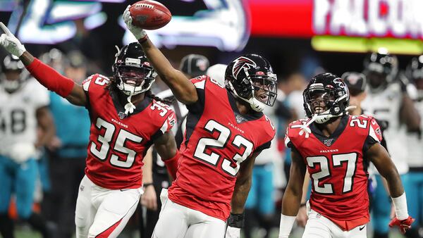 Falcons' Brian Hill (23) recovers a Jacksonville Jaguars fumble on a kickoff return the first quarter Sunday, Dec. 22, 2019, at Mercedes-Benz Stadium in Atlanta.