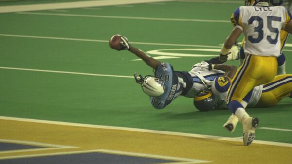 Rams linebacker Mike Jones makes a goal-line stop of Titans receiver Kevin Dyson to give the Rams a 23-16 win in Super Bowl XXXIV Jan. 30, 2000, at the Georgia Dome in Atlanta.