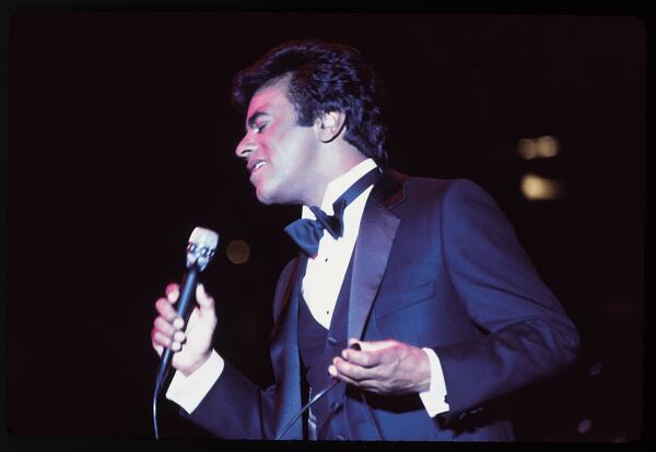 Johnny Mathis, seen here performing during the recording of a live album in 1984, is approaching his eighth decade as a performer. He will appear at the Cobb Energy Performing Arts Center Oct. 18. Photo: Sam Emerson/Columbia Records