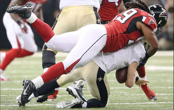 Atlanta Falcons inside linebacker Joplo Bartu (59) sacks New Orleans Saints quarterback Drew Brees (9) during the first half of an NFL football game, Thursday, Oct. 15, 2015, in New Orleans. (AP Photo/John Bazemore)