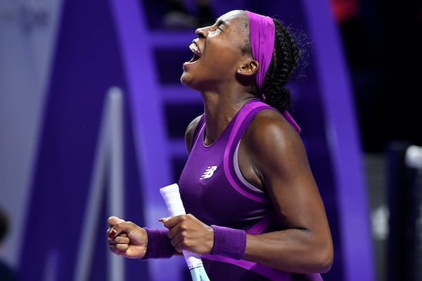 Coco Gauff of the U.S. reacts after winning against China's Qinwen Zheng in their women's singles final match of the WTA finals at the King Saud University Indoor Arena, in Riyadh, Saudi Arabia, Saturday, Nov. 9, 2024. (AP Photo)