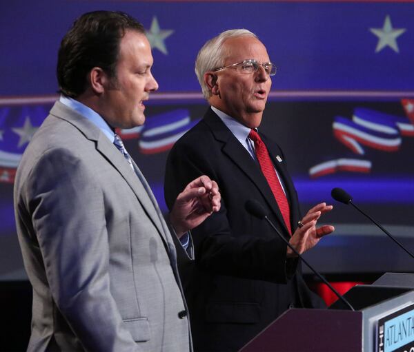 OCTOBER 12, 2014-ATLANTA: Chris Irvin (D-left) & Chris Irvin (D) spare during an Atlanta Press Club debate for the State Agriculture Commissioner at the Georgia Public Broadcasting studios in Atlanta on Sunday October 12th, 2014. (Photo by Phil Skinner)