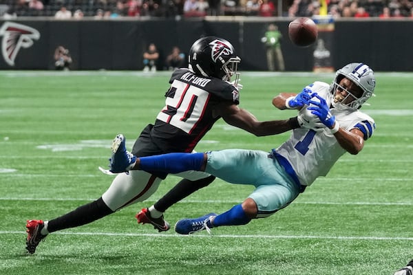 Dallas Cowboys wide receiver Jalen Tolbert (1) fails to pull in a pass against Atlanta Falcons cornerback Dee Alford (20) during the second half of an NFL football game, Sunday, Nov. 3, 2024, in Atlanta. (AP Photo/ Brynn Anderson)