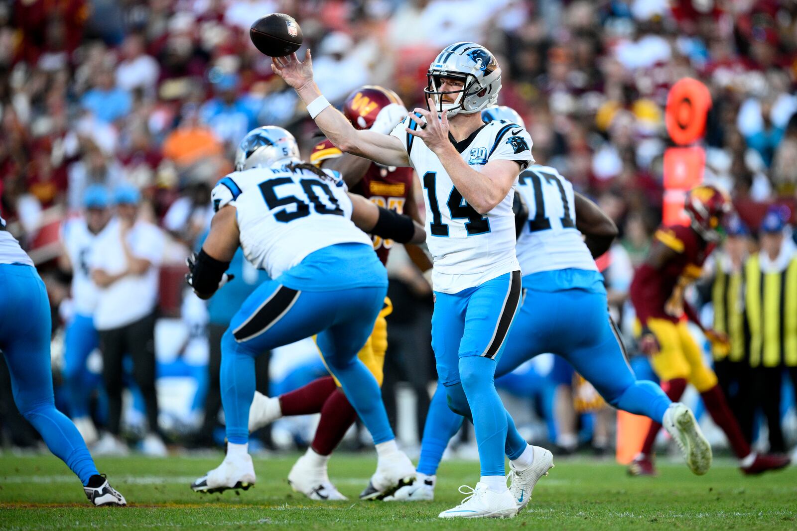 Carolina Panthers quarterback Andy Dalton (14) throws a pass during the first half of an NFL football game against the Washington Commanders, Sunday, Oct. 20, 2024, in Landover, Md. (AP Photo/Nick Wass)