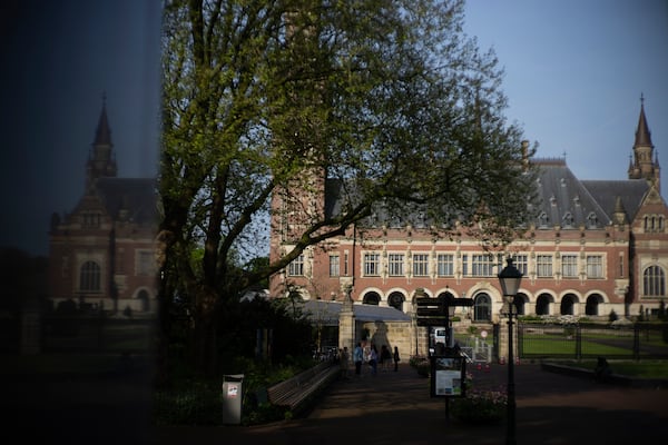 FILE - The Peace Palace housing the World Court, or International Court of Justice, is reflected in a monument in The Hague, Netherlands, Wednesday, May 1, 2024. (AP Photo/Peter Dejong, File)