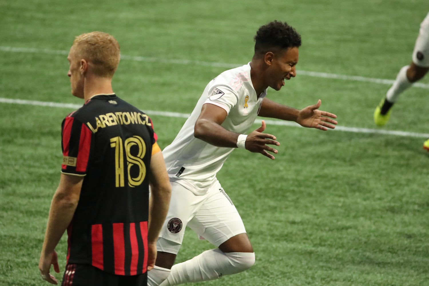 Miami forward Juan Aguedelo (12) celebrates his goal next to Atlanta United defender Jeff Larentowicz (18) in the first half at Mercedes-Benz Stadium Saturday, September 19, 2020 in Atlanta. JASON GETZ FOR THE ATLANTA JOURNAL-CONSTITUTION