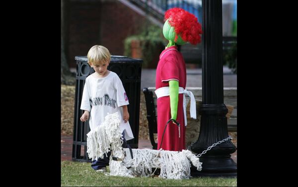 Taliesin Nelson, 3, of Marietta, does a double-take at one of the scarecrows on display on Marietta Square during the 2008 Harvest Square Arts and Crafts Festival. The event was renamed "HarvestFest" in 2015.