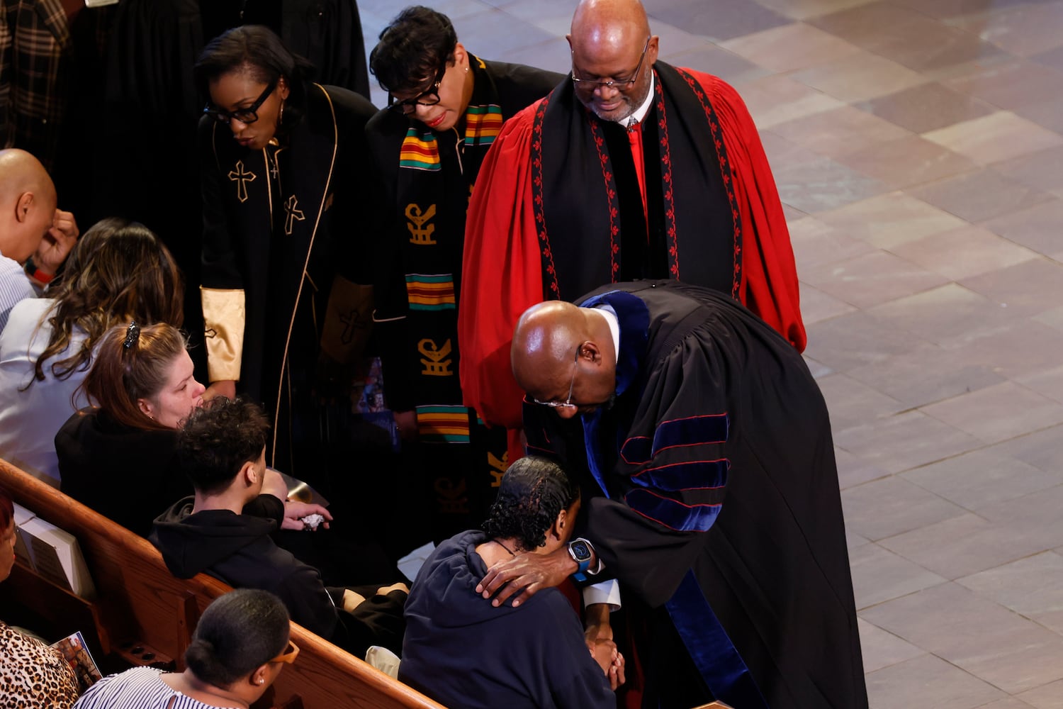 U.S. Sen.Raphael Warnock comforts Louis Taylor, mother of Cornelius Taylor, after his memorial service at Ebenezer Baptist Church on Monday, February 3, 2023. Taylor, a homeless man, died during an incident involving city workers clearing a homeless encampment on January 16.
(Miguel Martinez/ AJC)