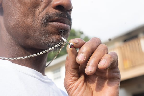 Alex Cardenas near his home in Atlanta, GA. He holds his engagement ring for his partner Shavon Miller. His partner Shavon Miller passed away from complications of abortion in the year of 2022. September 16th, 2024. Atlanta, GA