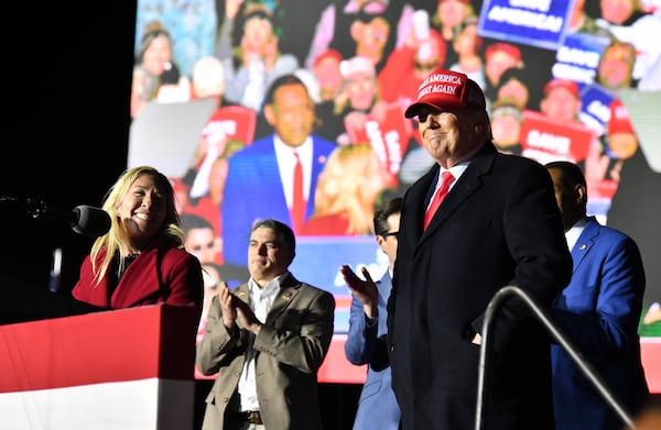 U.S. Rep. Marjorie Taylor Greene thanks former President Donald Trump during a rally for Georgia GOP candidates at Banks County Dragway in Commerce on Saturday, March 26, 2022.  A special grand jury in Fulton County investigated whether Trump and his supporters meddled in the 2020 elections in Georgia. (Hyosub Shin / Hyosub.Shin@ajc.com)