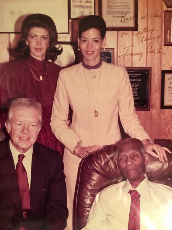 Former President Carter, bottom left, visited Benjamin Mays, bottom right, in 1983 to present him with an award, with former Atlanta Public Schools Archivist Cathy Loving, top right, and Mays secretary Sally Warner. (Courtesy Atlanta Public School Archives/Cathy Loving)