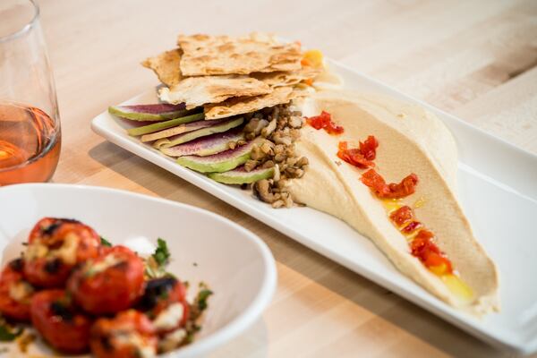 Old World Hummus with walnuts, watermelon radish, carrots, peppers and olive oil. Photo Credit- Mia Yakel