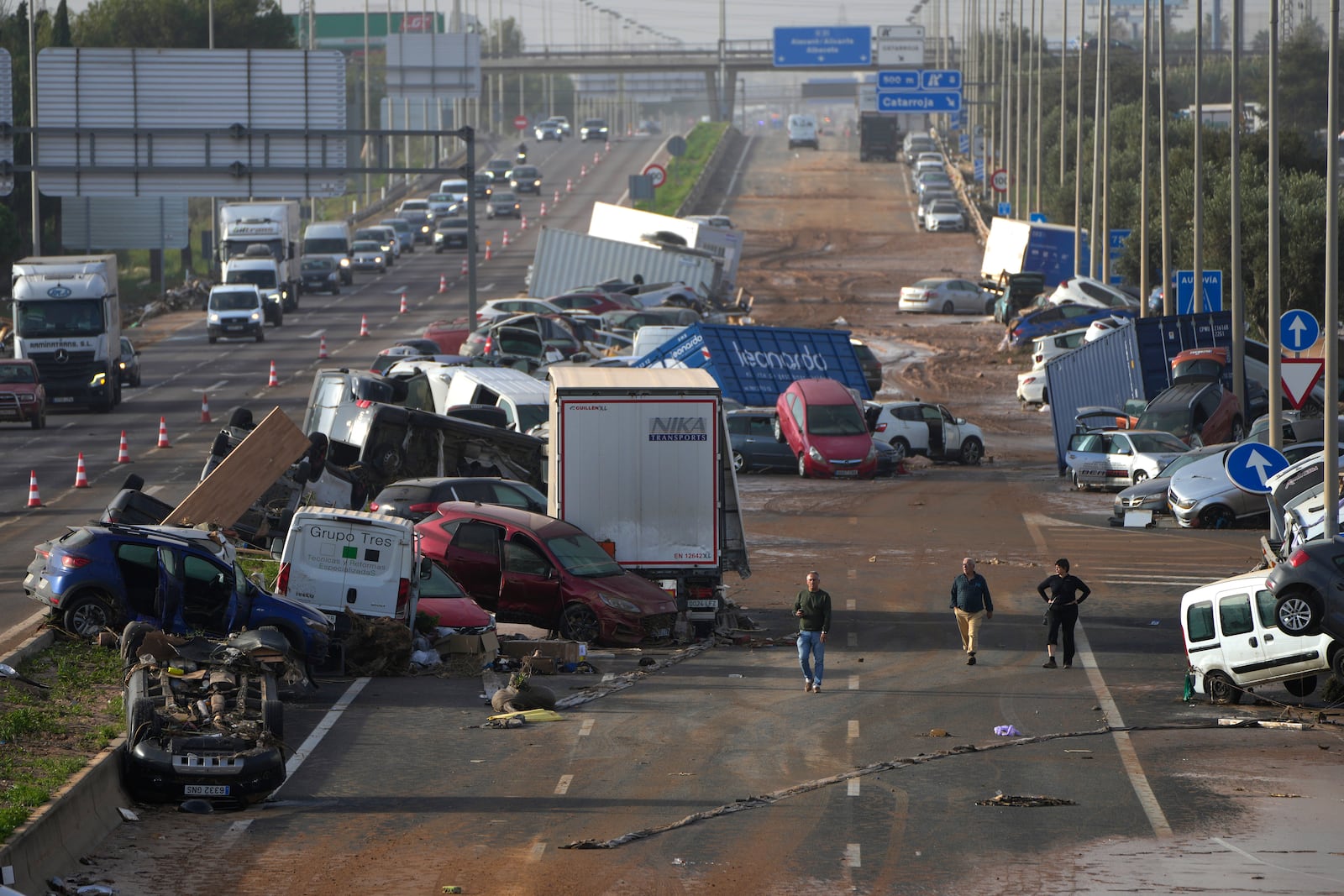 Vehicles are seen piled up after being swept away by floods on a motorway in Valencia, Spain, Thursday, Oct. 31, 2024. (AP Photo/Manu Fernandez)