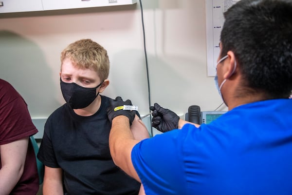 05/20/2021 — Dalton, Georgia — Larry Hall, 12, receives his first dose of the Pfizer COVID-19 vaccination shot during a visit to the Whitfield County Health Department in Dalton , Thursday, May 20, 2021. (Alyssa Pointer / Alyssa.Pointer@ajc.com)