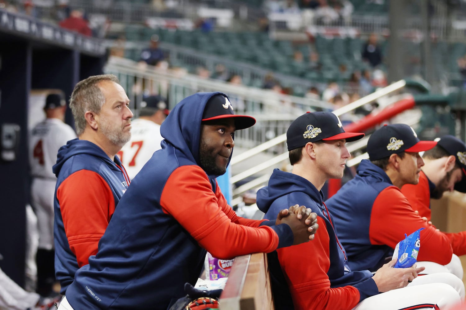 Braves players watch Monday night at Truist Park. The Nationals won the series opener. (Miguel Martinez/miguel.martinezjimenez@ajc.com)