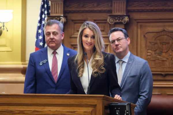 Former U.S. Sen. Kelly Loeffler, head of the Small Business Administration, speaks to the Georgia Senate at the Capitol in Atlanta on Monday. Standing with her are Sen. Steve Gooch (left), a Republican from Dahlonega, and Lt. Gov. Burt Jones.