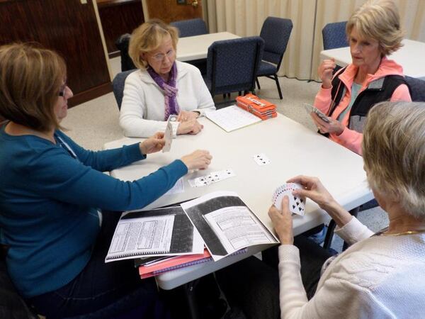 Beginning bridge players are engrossed in a match at one of the Forsyth County senior centers. About 16 percent of Forsyth’s population is age 60 or older, a percentage that is expected to increase over the next two decades. 