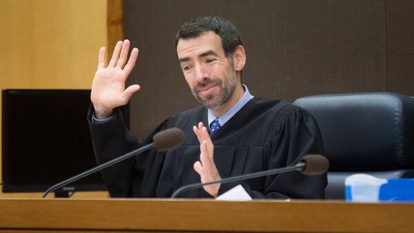 Fulton County Chief Judge Robert McBurney talks to jurors Friday during the fifth day of jury selection for the Tex McIver case in a Fulton County courtroom. STEVE SCHAEFER / SPECIAL TO THE AJC