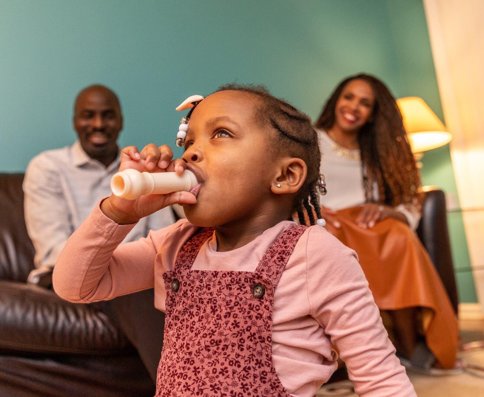 The McCown family is busy with their 2-year-old Priya McCowan, who turns three in early March and is leading an impromptu music jam session at their home Tuesday, Feb 8, 2022.  Emanuel and Penelope McCowan struggled for years with fertility issues and Penelope now has a blog and a small business built to help others in her situation.  (Jenni Girtman for The Atlanta Journal-Constitution)