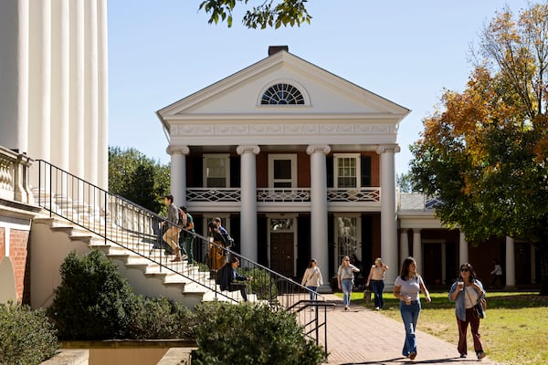 People climb steps to the Rotunda at the University of Virginia in Charlottesville, Va., Friday, Oct. 11, 2024. (AP Photo/Ryan M. Kelly)