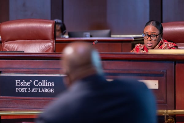 Council member Eshe’ Collins listens to a report during a City Council public safety committee meeting at City Hall in Atlanta on Monday, February 24, 2025. The report by Atlanta Citizen Review Board executive director Lee Reid (center) is in response to an AJC investigation about why the Atlanta Citizen Review Board did not investigate police shootings and in-custody deaths. (Arvin Temkar / AJC)