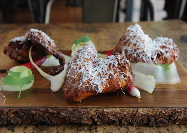 Chef Justin Balmes’ dry-rubbed and smoked wings with avocado/jalapeno/garlic dressing, baby turnips, radish, manchego. (BECKY STEIN PHOTOGRAPHY)