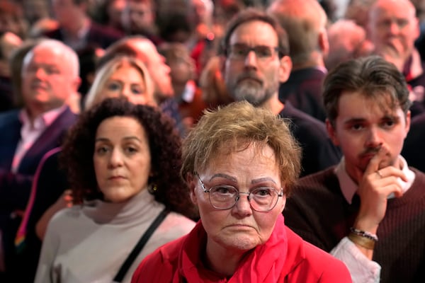 People react after first projections are announced during the election party at the Social Democratic Party (SPD) headquarters in Berlin, Germany, Sunday, March 23, 2025. (AP Photo/Ebrahim Noroozi)