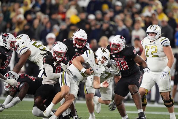 Georgia Tech quarterback Aaron Philo (12) runs the ball during the first half of an NCAA college football game against North Carolina State, Thursday, Nov. 21, 2024, in Atlanta. (AP Photo/Brynn Anderson)