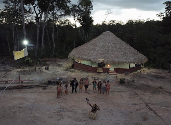 Members of the Indigenous ethnic group Kokama perform a ritual to send good energies to Brazilian actress Fernanda Torres, who's been nominated for a best actress Oscar for her role in the film "I'm Still Here," at the Inhaa-be village, Manaus, Amazonas state, Friday, Feb. 28, 2025. (AP Photo/Edmar Barros)