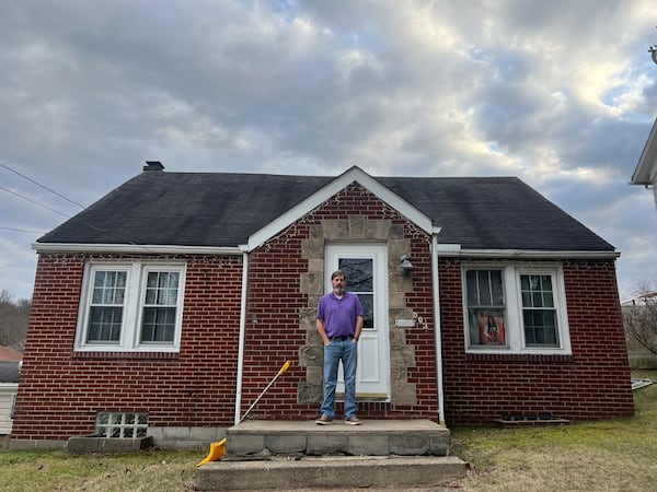 Chris Albright stands in front of his house in East Palestine, Ohio.