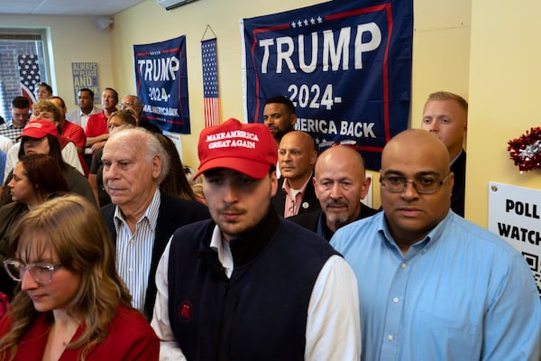 FILE - Attendees gather as the "Latino Americans for Trump" office opens in Reading, Pa., June 12, 2024. (AP Photo/Joe Lamberti, File)