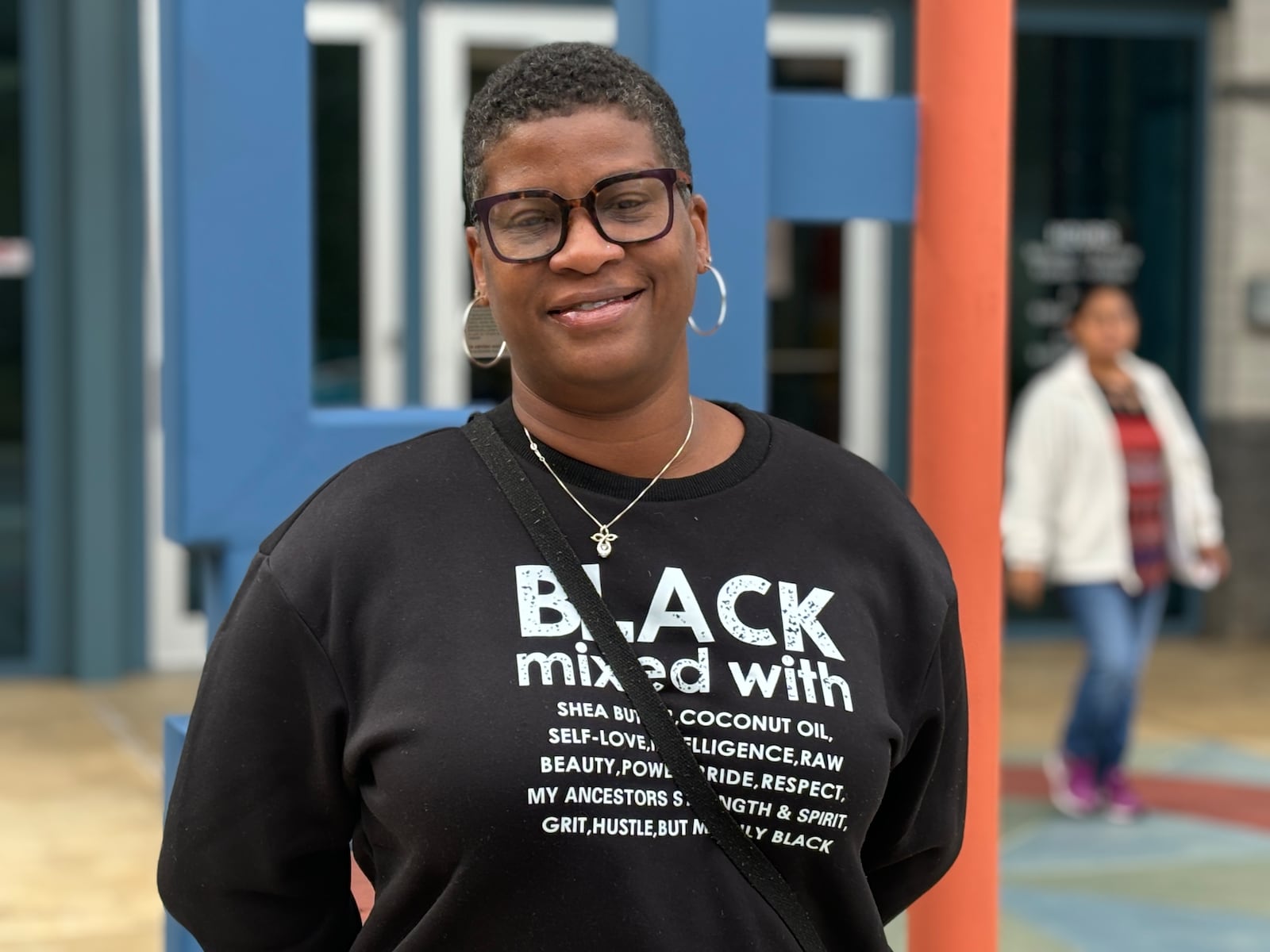 Angel Berry stands outside a polling location in the city of Norcross, Gwinnett County on Oct. 15, 2024 (Matt Reynolds/ AJC)