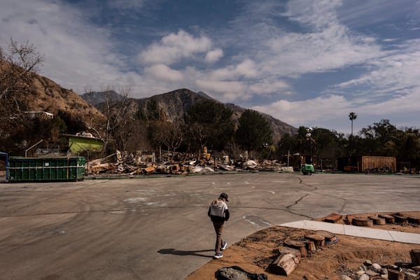 Ceiba Phillips, an 11-year-old Eaton Fire evacuee, visits his school gutted by the fire in Altadena, Calif., Saturday, Feb. 8, 2025. (AP Photo/Jae C. Hong)