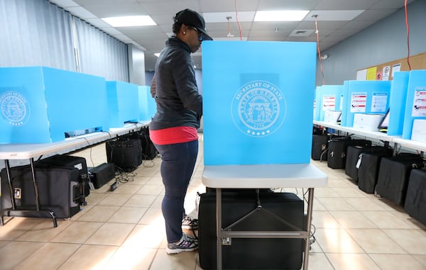 Yolanda Norman of DeKalb County uses te new voting machines at Voter Registration and Elections Office in Atlanta on Monday, March 2, 2020. Miguel Martinez for the Atlanta Journal-Constitution