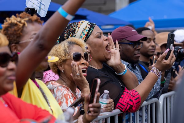 Supporters cheer for Vice President Kamala Harris at a Juneteenth Block Party campaign event outside her new campaign headquarters in Atlanta on Tuesday, June 18, 2024. (Arvin Temkar / AJC)