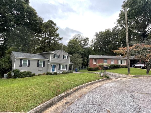 The owner of the painted home in the foreground is being cited by the city for violating the Collier Heights' neighborhood's historic code. Photo by Bill Torpy