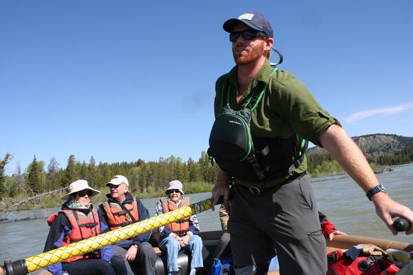 Included among the offerings of Tauck's national parks tours is a 10-mile rafting journey on the Snake River. Grand Teton Lodge Company's Mike OâNeil leads a group past the spectacular scenery of Grand Tetons National Park. (Mary Ann Anderson/TNS)