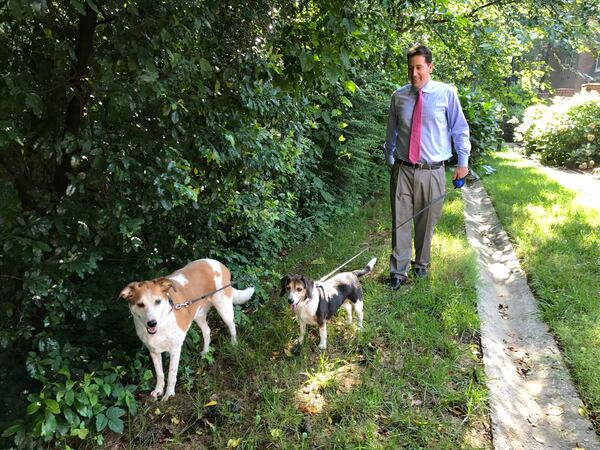  Mark Arum with his dogs Deuce (left) and Boscoe (center) CREDIT: Rodney Ho/rho@ajc.com