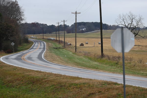 Pasture land sits on either side of Davis Academy Road where it runs through the planned Rivian electric vehicle plant site on Wednesday, Dec 8, 2021, near Rutledge, Georgia.   “Curtis Compton / Curtis.Compton@ajc.com”`