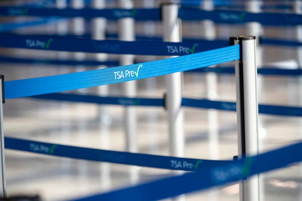 11/23/2020 �  Atlanta, Georgia �A TSA PreCheck retractable belt barrier is displayed at the new South checkpoint security screening in the Domestic Terminal at the airport in Atlanta , Monday, November 23, 2020.  (Alyssa Pointer / Alyssa.Pointer@ajc.com)