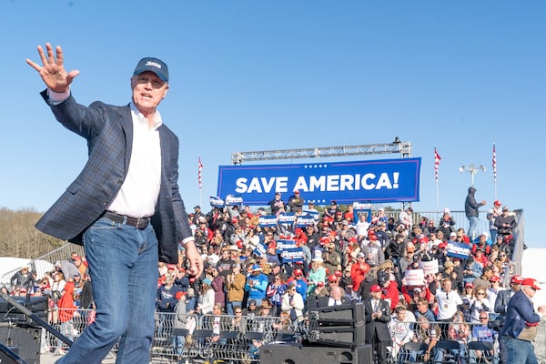 Former U.S. Sen. David Perdue waves to supporters after speaking at former President Donald Trump's rally on March 26 in Commerce to support Perdue and other candidates he is backing in the GOP primary. Perdue, who is trying to unseat fellow Republican Gov. Brian Kemp, did not get a big bounce from Trump's appearance. He trails Kemp by double digits in the latest Emerson College/The Hill poll. (Megan Varner/Getty Images/TNS)