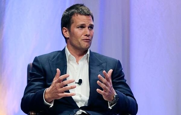 FILE - In this May 7, 2015, file photo, New England Patriots quarterback Tom Brady gestures during an event at Salem State University in Salem, Mass. Brady's four-game suspension for his role in using underinflated footballs during the AFC championship game last season has been upheld by NFL Commissioner Roger Goodell. The league announced the decision Tuesday, July 28, 2015. (AP Photo/Charles Krupa, Pool)