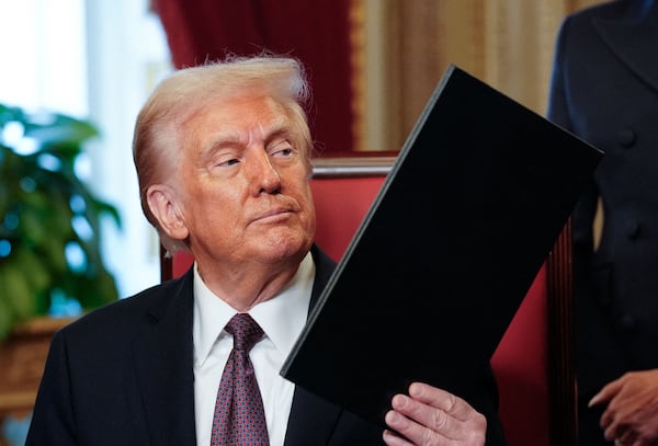 Newly sworn-in President Donald Trump takes part in a signing ceremony at the U.S. Capitol on Monday. 