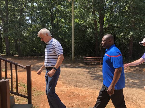 Long-time Maranatha Baptist Church member Mashuq Askerzada and pastor Tony Lowden go on a home visit last week in Plains as they delivered boxes of groceries to residents. When Lowden was hired, President Carter asked him to do three things: visit white churches, visit hospitals and be a presence in the community.