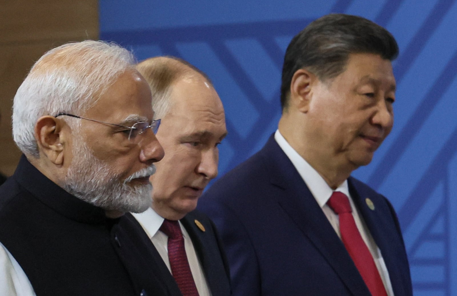 From left: Indian Prime Minister Narendra Modi, Russian President Vladimir Putin and Chinese President Xi Jinping attend a family photo prior to the BRICS Summit plenary session in Kazan, Russia, Wednesday, Oct. 23, 2024. (Maxim Shipenkov, Pool Photo via AP)