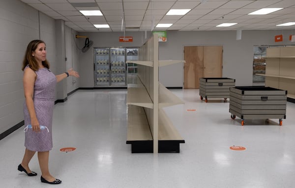 Sarah Fonder-Kristy, chief development officer of the Atlanta Community Food Bank, shows off where supplies will be located at the new Community Food Center in Stone Mountain. Ben Gray for the Atlanta Journal-Constitution