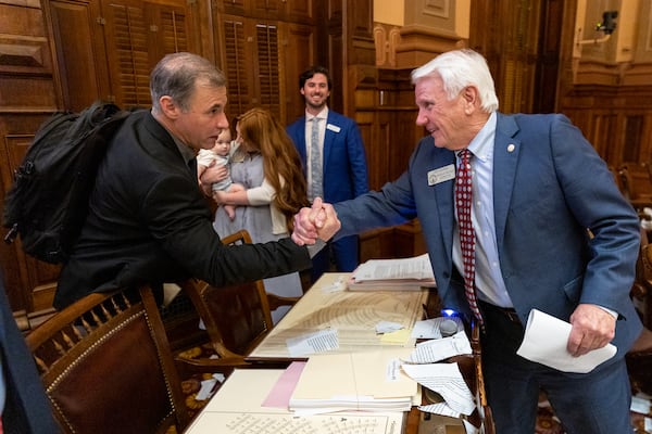 State Rep. Reynaldo "Rey" Martinez, R-Loganville, and House Speaker Jon Burns, R-Newington, shake hands at the conclusion of the legislative session. (Arvin Temkar / arvin.temkar@ajc.com)