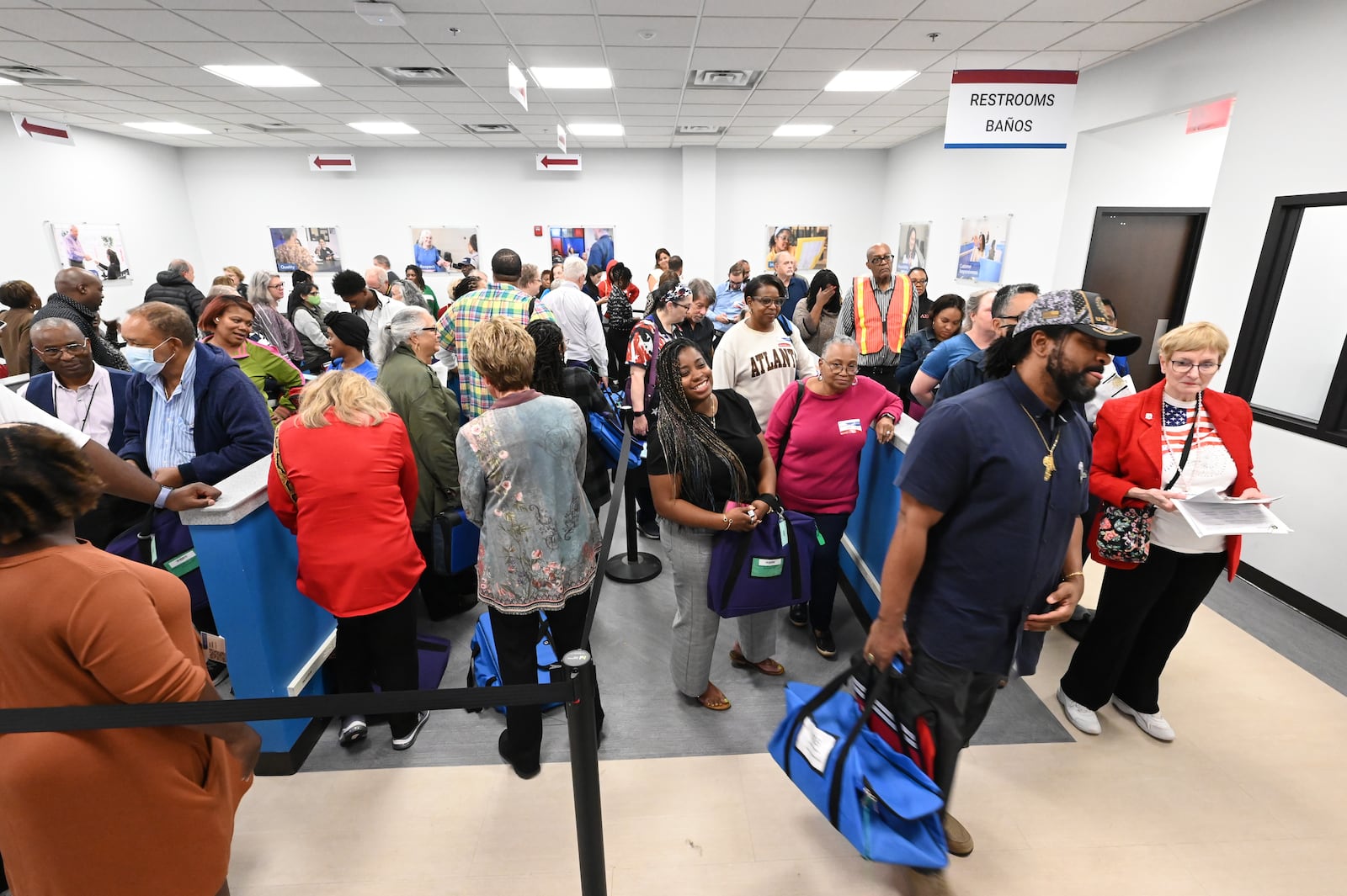 Poll workers bring in bags containing ballots from various precincts on Election Day at Gwinnett County Voter Registrations & Elections, Tuesday, November 5, 2024, in Lawrenceville. (Hyosub Shin / AJC)